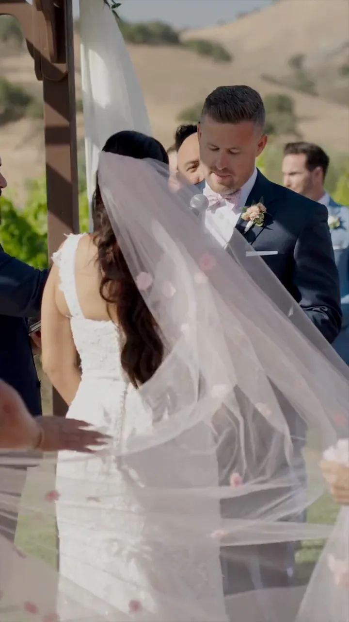 Arlene in a veil with Ian and the hills behind them