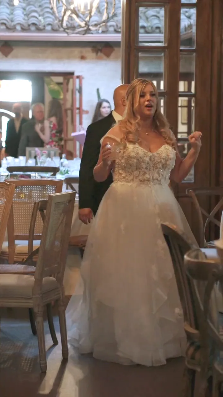 A bride seeing her dressed reception room for the first time